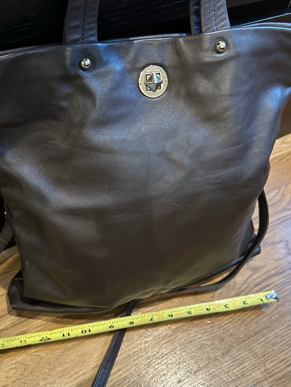 kate spade black leather tote with star emblem hardware